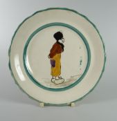 A LLANELLY POTTERY 'DUTCH BOY' TEA-PLATE the figure standing with hands behind back, 18cms diam