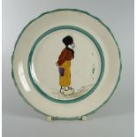 A LLANELLY POTTERY 'DUTCH BOY' TEA-PLATE the figure standing with hands behind back, 18cms diam