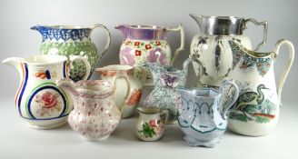 A COLLECTION OF TEN VARIOUS POTTERY JUGS all believed to be Welsh and includes small Llanelly rose