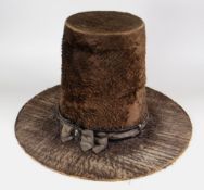 A 19TH CENTURY TRADITIONAL WELSH LADIES HAT in brown believed beaver-fur with original silk ribbon