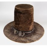 A 19TH CENTURY TRADITIONAL WELSH LADIES HAT in brown believed beaver-fur with original silk ribbon