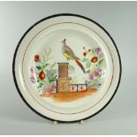 A SWANSEA DILLWYN POTTERY 'BIRD ON PEDESTAL' PLATE with polychrome decoration to the interior,