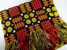 A GOOD TRADITIONAL WELSH WOOLEN BLANKET of black ground with red, orange and mustard geometric