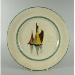 A LLANELLY PLATE DECORATED WITH SAIL BOATS with slight wavy border, 22cms diam Condition Report: