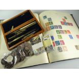 A vintage blue stamp album & approximately 20% completion, parcel of loose coinage, collector's