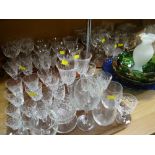 A large parcel of glassware including drinking glasses, fruit bowls, cut glass etc