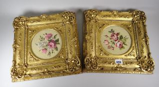 A pair of good antique framed embroidered floral panels