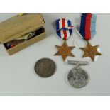 A WWII medal replacement group for Mr R J Howells-Jones with original box and papers, comprising