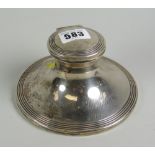A circular based silver mounted inkwell with hinged lid inscribed & dated 1910