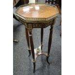 A rosewood & metallic galleried planter stand in the French-Empire style