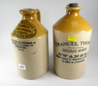 Two turn of the century stoneware spirit bottles, one printed with 'Emanuel Thomas Niagra Works,