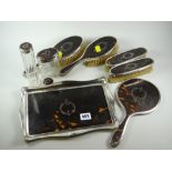 A very good matching silver & tortoiseshell dressing-table set comprising four brushes, two bottles,