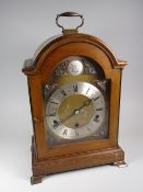 A good Elliott reproduction dome-topped & engraved brass face bracket clock with silver dial bearing