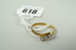 An 18ct three-stone diamond ring, 2.3grms