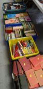 Nine plastic crates of mixed books including some interesting vintage hardback fiction, a tub of