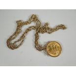 A 1966 gold full sovereign on a 9ct chain, 24grams total