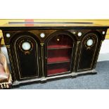 An antique ebonized & inlaid credenza composed of flanking arched enclosed cupboards & centre glazed