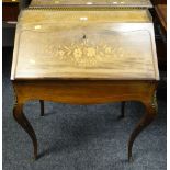 An antique marquetry walnut ladies writing desk with ormolu decorative mounts & gallery, 65cms wide