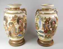 A pair of Satsuma crackle-glaze baluster vases with twin handles & relief decoration on wooden