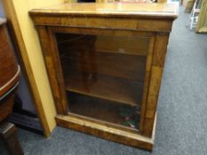 An antique inlaid walnut single-door pier cabinet with metallic decoration (distressed), 85cms wide