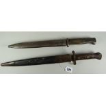 Two WW1 bayonets, one marked GEBR. HARTKOPP SOLNGEN to the blade, both with their covers
