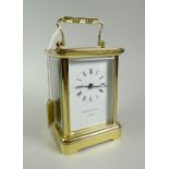 A modern Matthew Norman carriage clock with white face & Roman numeral dial