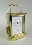 A modern Matthew Norman carriage clock with white face & Roman numeral dial