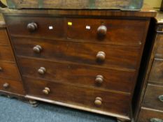 An antique mahogany chest of three long & two short drawers with turned handles & turned feet