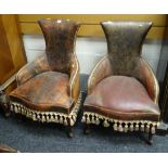A pair of small unusual vintage leather chairs with studded arms & tasselled fringes, possibly