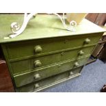 An antique green painted pine chest of four drawers