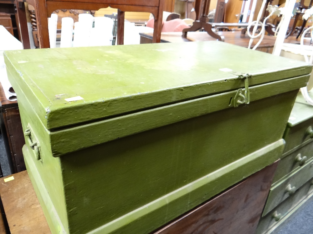 A vintage green painted pine blanket chest with contents