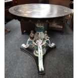 An unusual antique table having an Italianate porcelain & wooden painted cherubic tri-form base