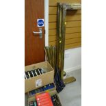 A brass fender & brass stair rods together with fittings & screws