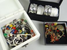 A modern box of costume jewellery & cased set of napkin rings