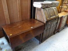 A vintage linen-fold bureau, an antique drop-flap table & three vintage suitcases