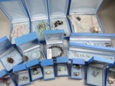 A quantity of boxed silver jewellery