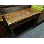An antique mahogany fold-over table with single drawer