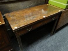 An antique mahogany fold-over table with single drawer