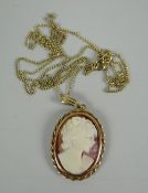A small oval cameo pendant on a very fine gold necklace