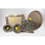 Five silver picture frames including an Art Nouveau decorated example, an oval example & a