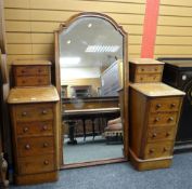 A flame mahogany pedestal dressing table with centre swing mirror & two banks of four drawers