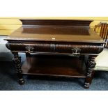 An antique mahogany buffet sideboard with carved features & copper handles, 121cms wide