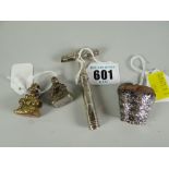A novelty silver basket pin cushion, a silver (hallmarks rubbed) miniature toffee-hammer & two