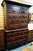 An antique Victorian chest-on-chest composed of six long & two short drawers with carved frieze,