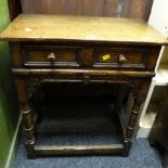 An antique-reproduction side-table with single drawer