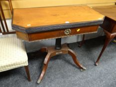 An antique foldover baize lined card table with ebony stringing & metallic mounts
