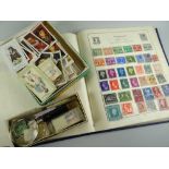 A blue Strand stamp album with near completed contents & a quantity of cigarette cards