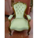 Medium sized button upholstered spoonback armchair