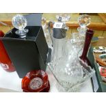 Boxed Thomas Webb square based decanter and stopper, three other square based decanters, claret