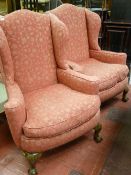 Pair of matching classically upholstered highback winged armchairs